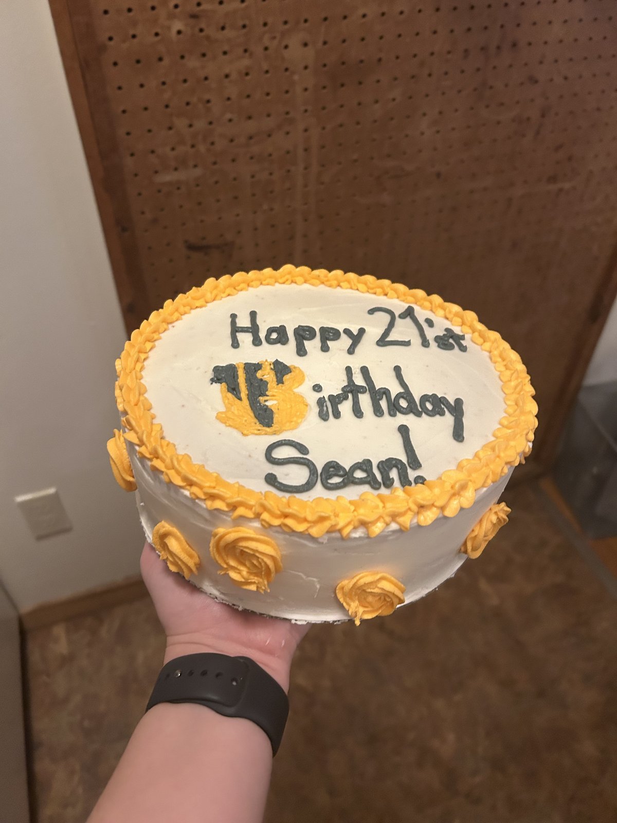21st birthday cake with yellow rosettes
