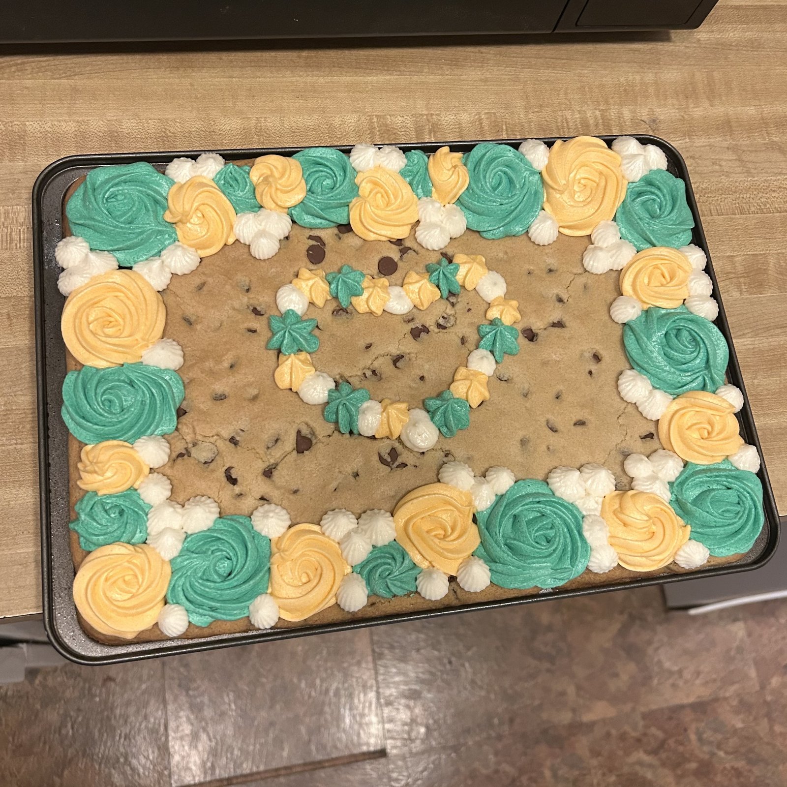 Chocolate chip cookie cake with frosting